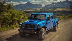 the 2024 Jeep Gladiator driving on a dirt road