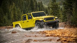 The 2024 Jeep Gladiator Rubicon X off-roading through a river