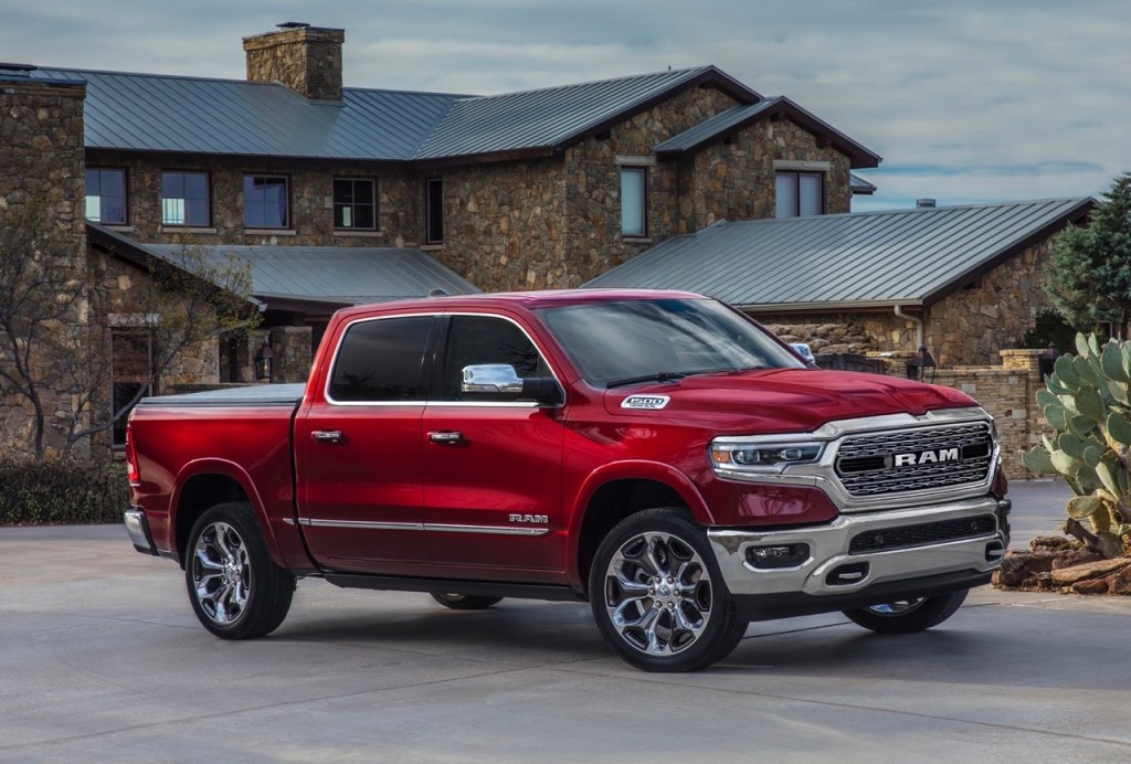 The 2024 Ram 1500 parked by a home