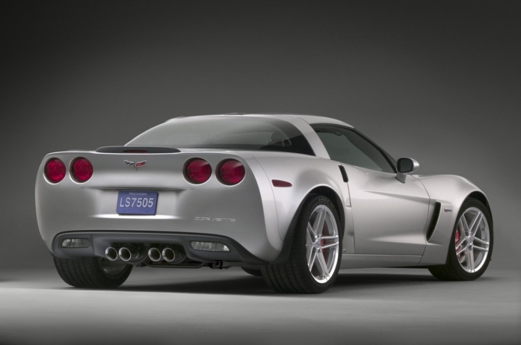 A silver, 200 MPH C6 Corvette Z06 shows off its rear-end styling and wide tires.