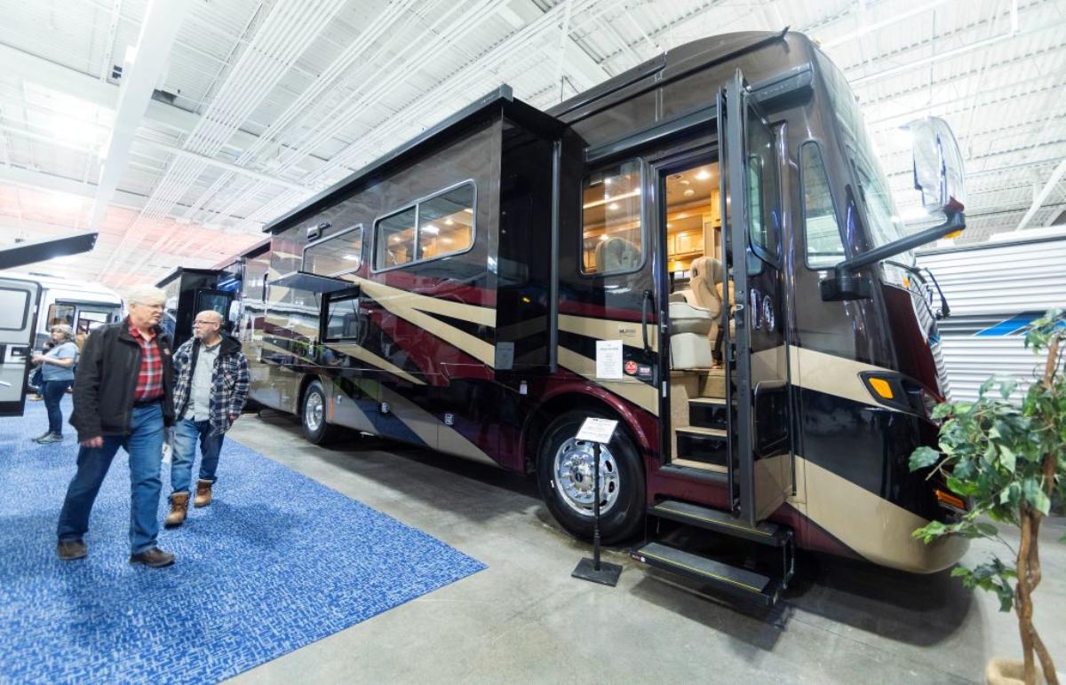 Two people looking at a new RV.