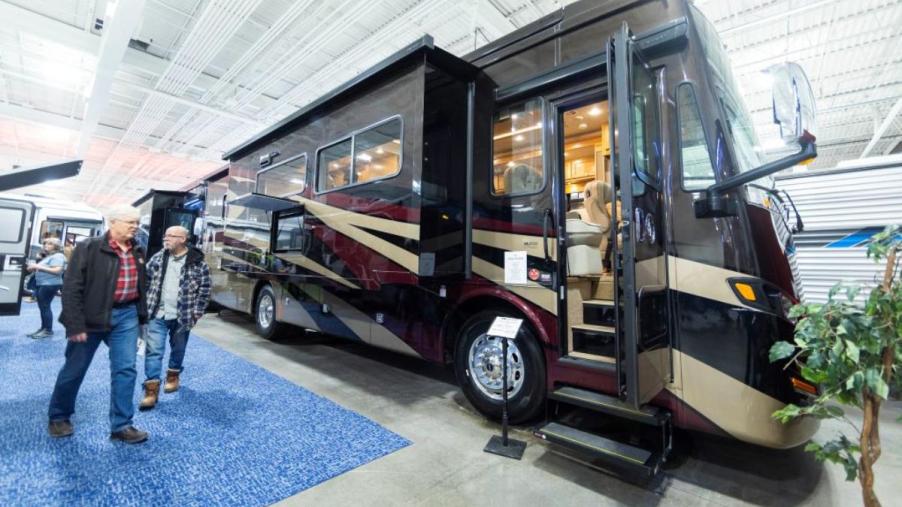 Two people looking at a new RV.