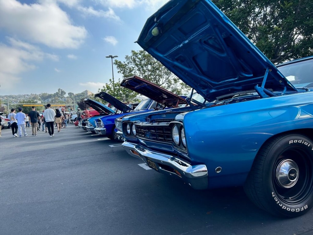 A row of classic cars line up at the San Clemente weekly car show.
