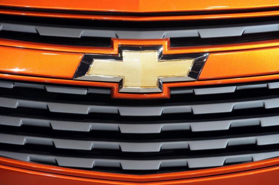 An orange 2011 Chevy Cruze compact car displaying the Chevrolet bow tie symbol
