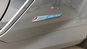 A badge gleams on a 2024 Chevrolet Corvette E-Ray, the best car for snow in the model's lineup.