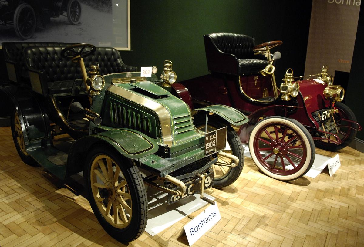 Cadillac's first cars on display at a history museum.