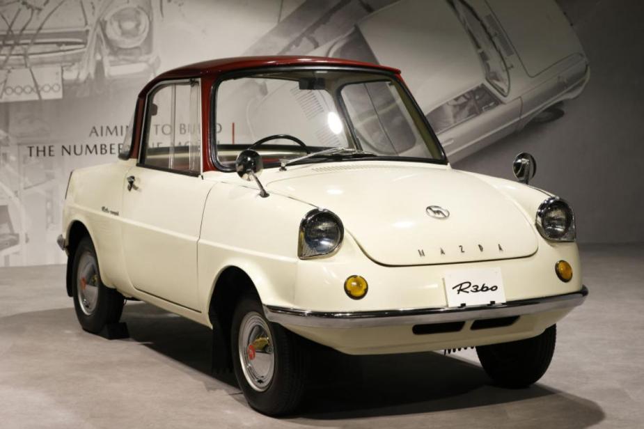 A Mazda R360 on display at a museum.