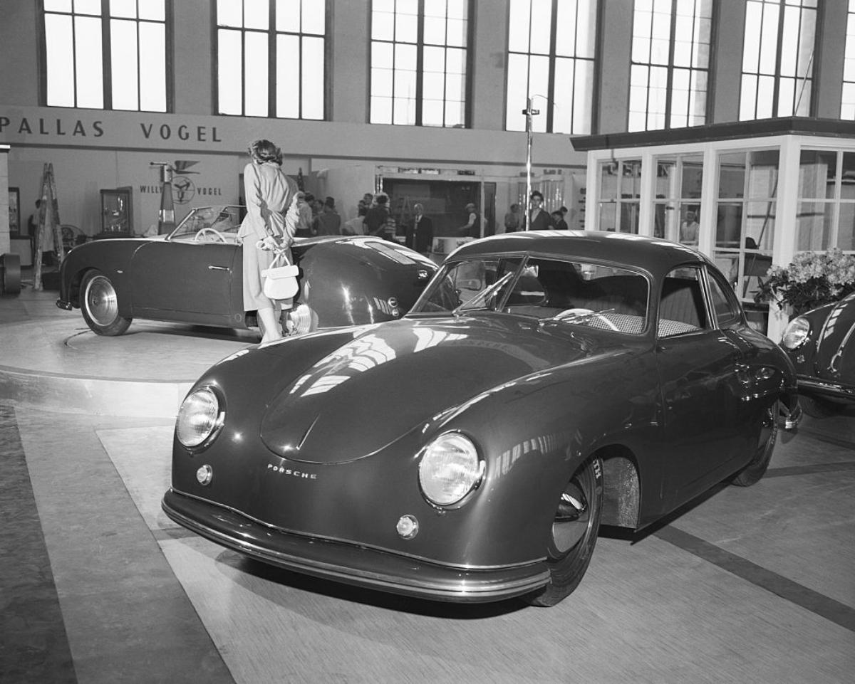 A Porsche 356 on display at an auto show.