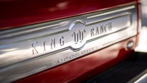 The King Ranch logo and name on the red tailgate of a top-trim Super Duty F-250 truck.