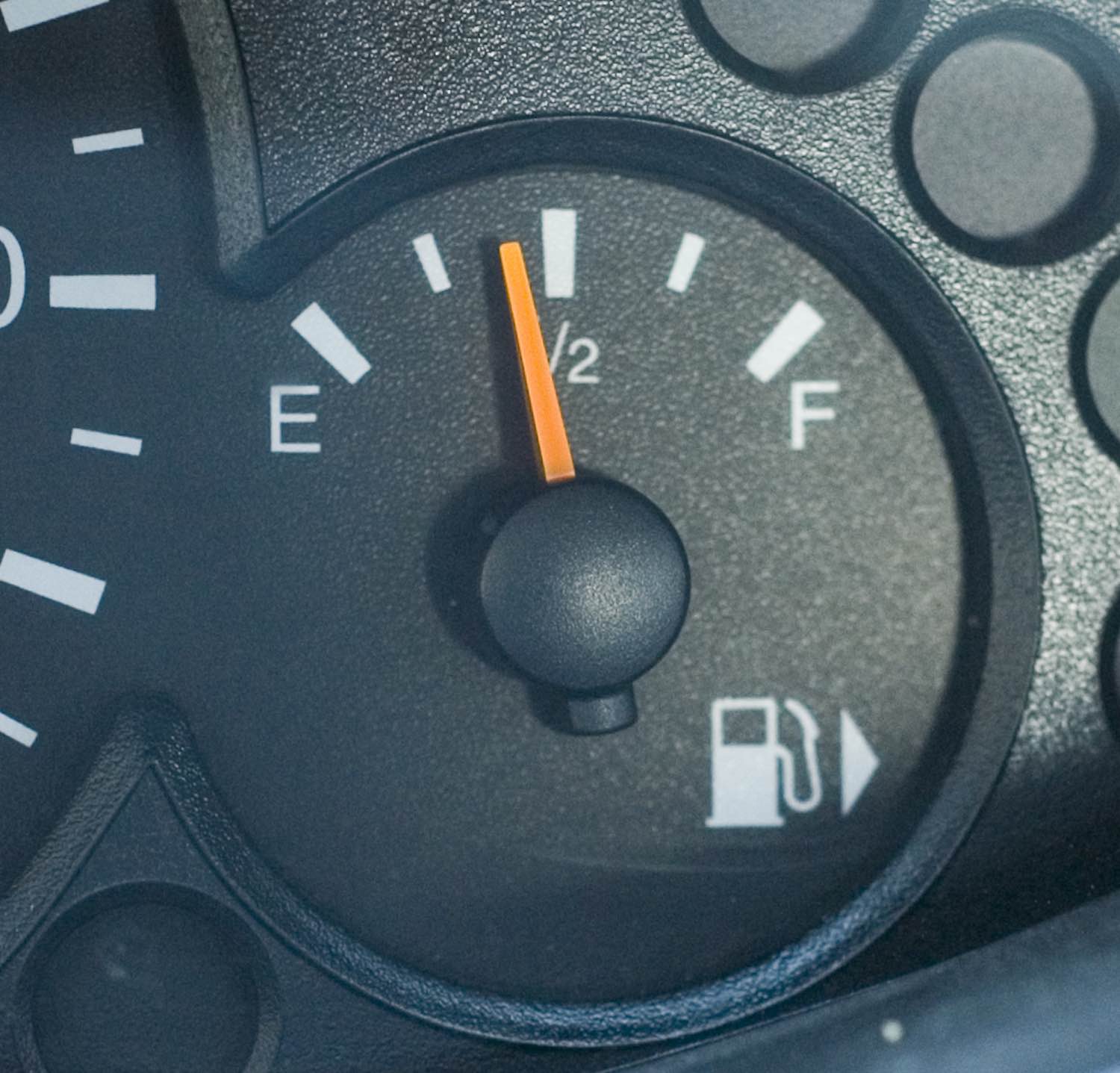 Black fuel gauge with white "E" and "F" letters on either end of the needle.