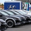 Hyundai cars at dealership with Hyundai logo in background