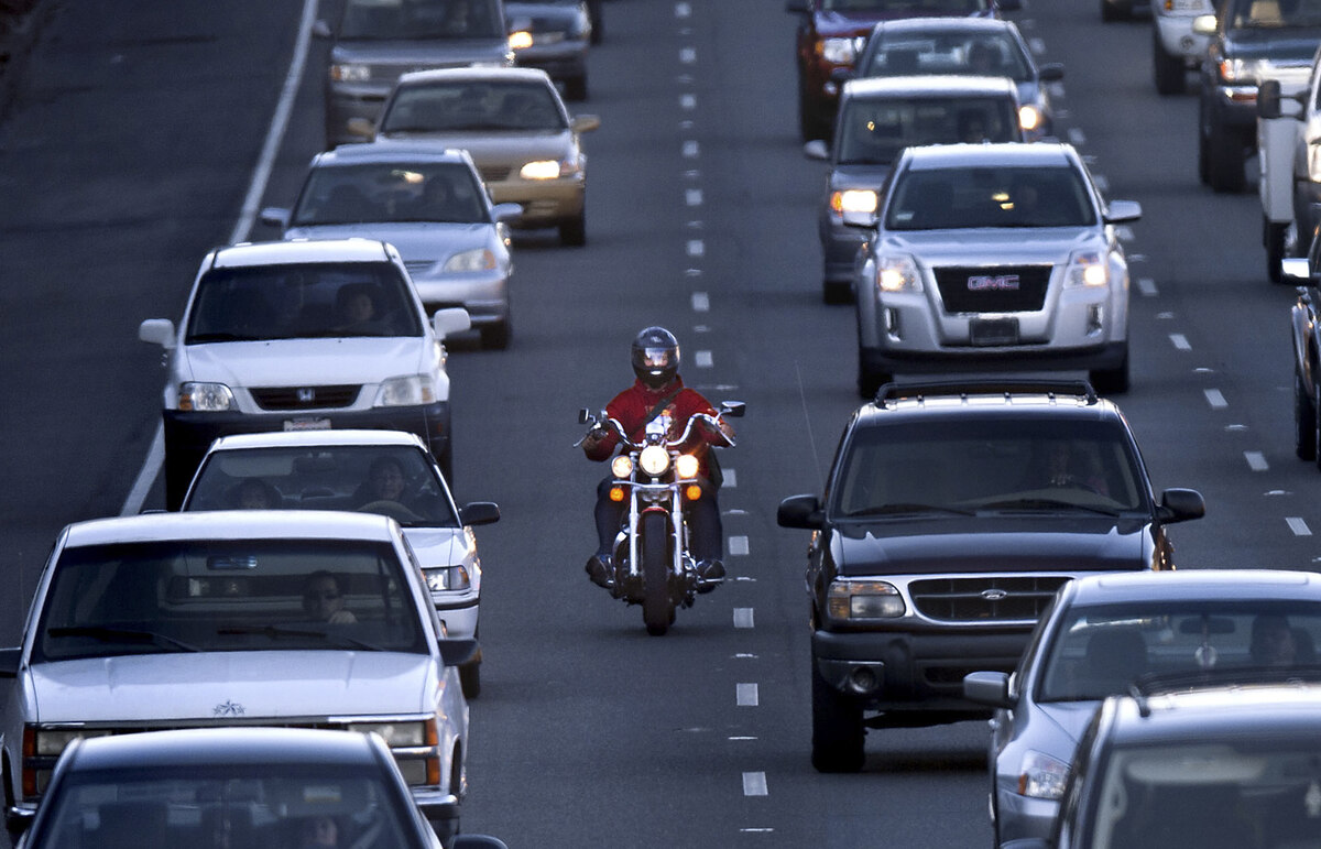 Lone motorcyclist in traffic