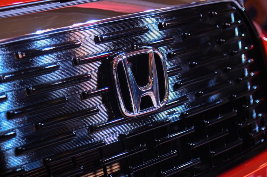 The Honda logo on the front grille of an SUV. Car sales for Honda and other manufacturers are up this year.