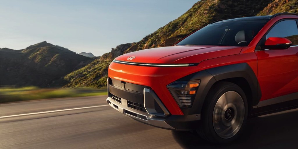 The front of an orange 2024 Hyundai Kona.