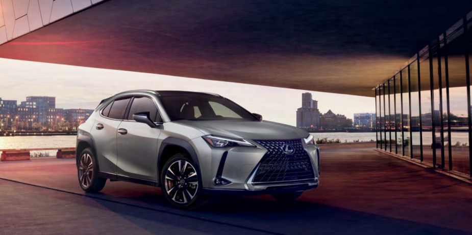 A gray Lexus UX subcompact luxury SUV is parked. 