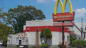 A McDonald's sign over the restaurant's drive-through lane.