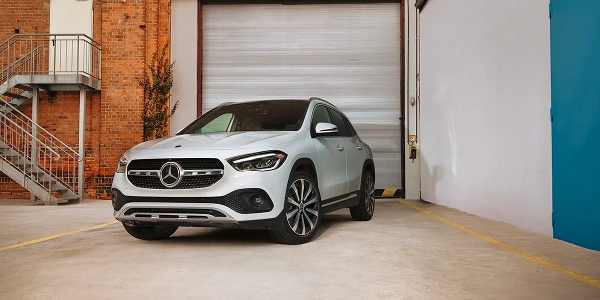 A white Mercedes-Benz GLA-Class subcompact SUV is parked.