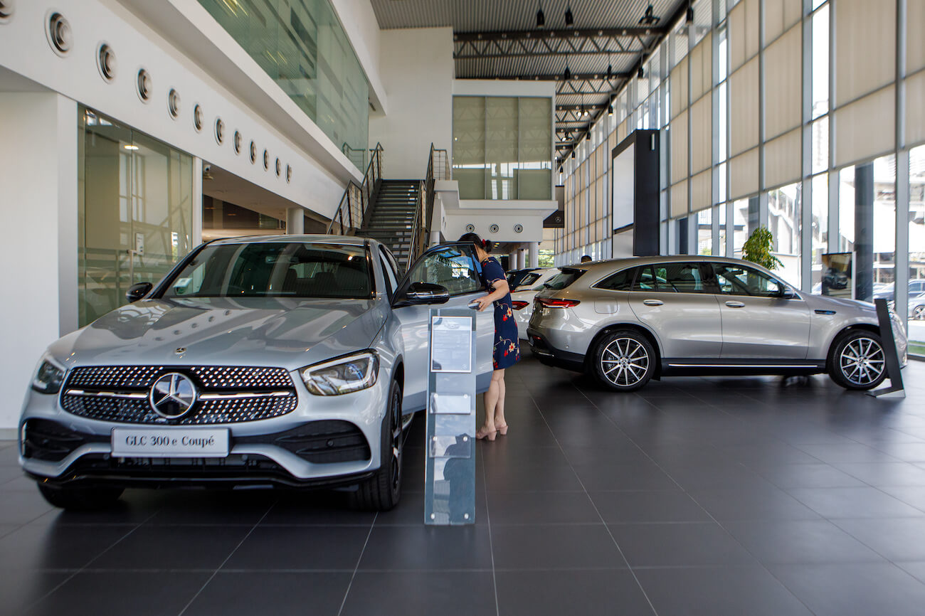 A customer looks at a Mercedes-Benz Group AG GLC 300e Couple vehicle inside the company's showroom in Petaling Jaya, Selangor, Malaysia. The Mercedes-Benz GLC price changes when it's fully equipped.
