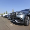 A Mercedes-Benz AG GLE SUV and other new and used automobiles in a customer collection parking lot at a Daimler AG showroom. The Mercedes-Benz GLE price makes it a better choice than the Maserati Levante.