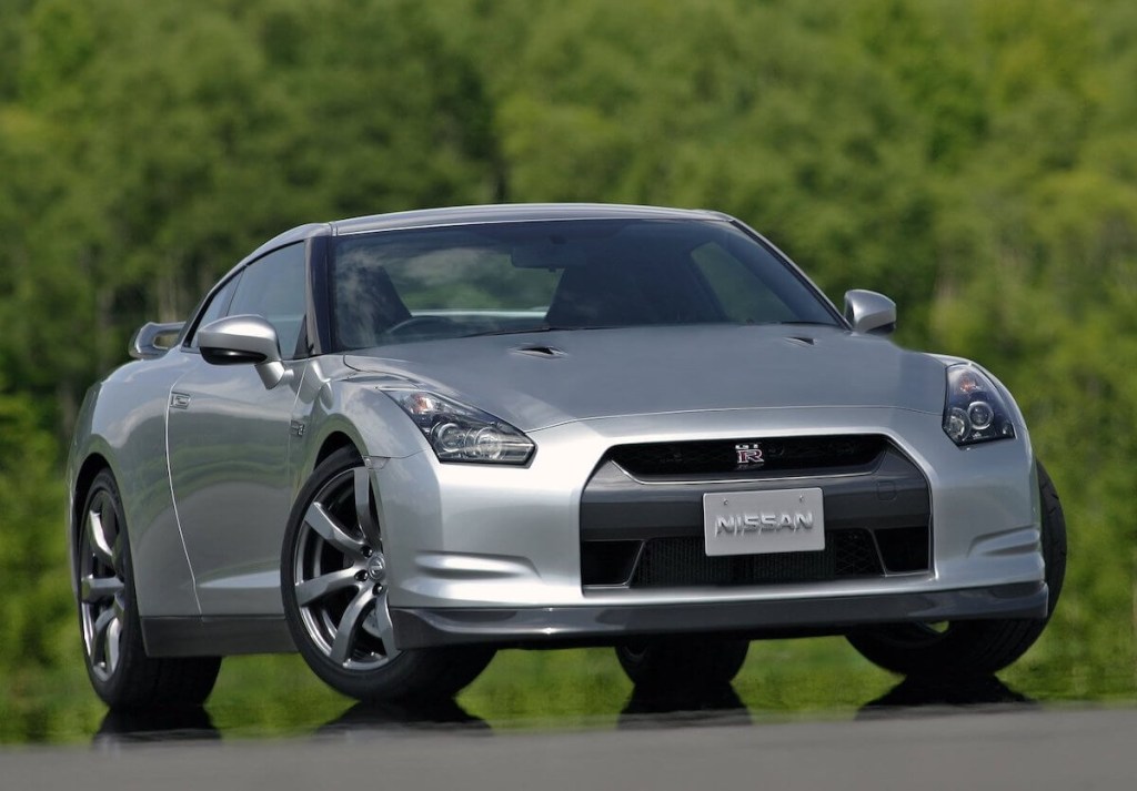 A 2009 Nissan GT-R AWD sports car in silver, and parked outdoors