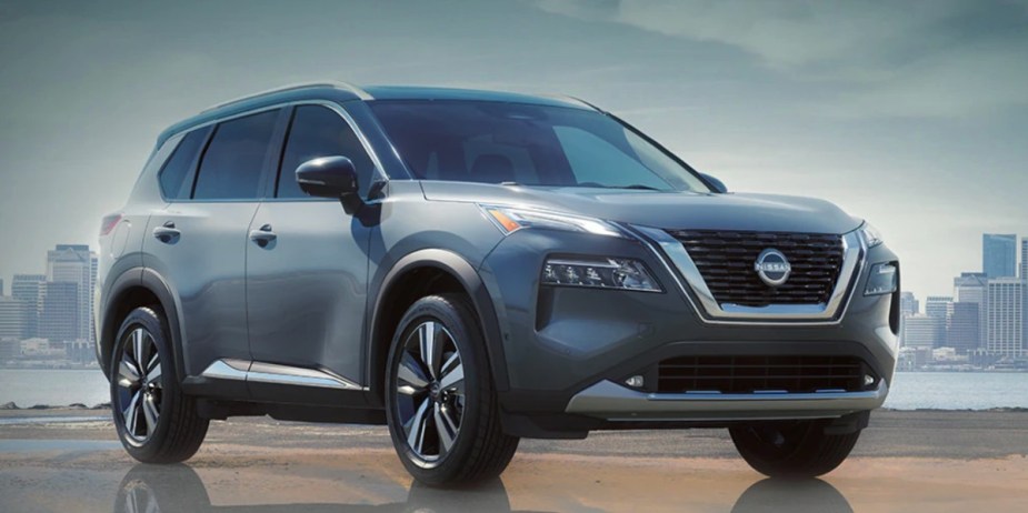 A gray 2023 Nissan Rogue small SUV is parked. 