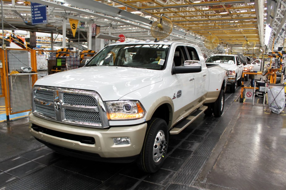 White heavy-duty Ram 3500 pickup truck with a Cummins engine rolling off the Mexico assembly line.