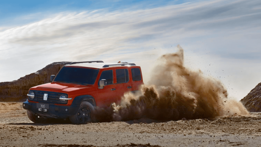 Orange 2023 Great Wall Tank 300 midsize SUV front 3/4 view