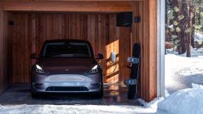 A gray Tesla Model Y parked and charging in a garage. The Tesla Model Y Juniper might borrow from the Model 3 refresh.
