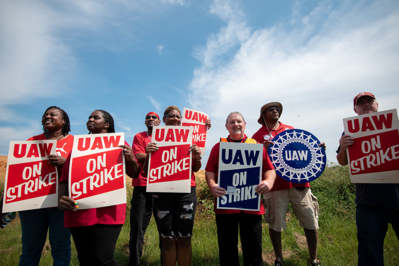 United Auto Workers (UAW) members and supporters on a picket line outside the ZF Chassis Systems plant in Tuscaloosa, Alabama. UAW auto strikes are already having an impact.