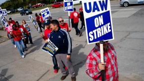 UAW workers striking against Ford, GM, and Stellantis for better pay among record high profits