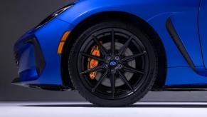 A closeup shot of the front tire and Brembo brake caliper on a 2024 Subaru BRZ tS sports car coupe model