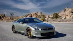 A 2024 Nissan GT-R T-Spec sports car coupe model parked on a empty asphalt road in the desert
