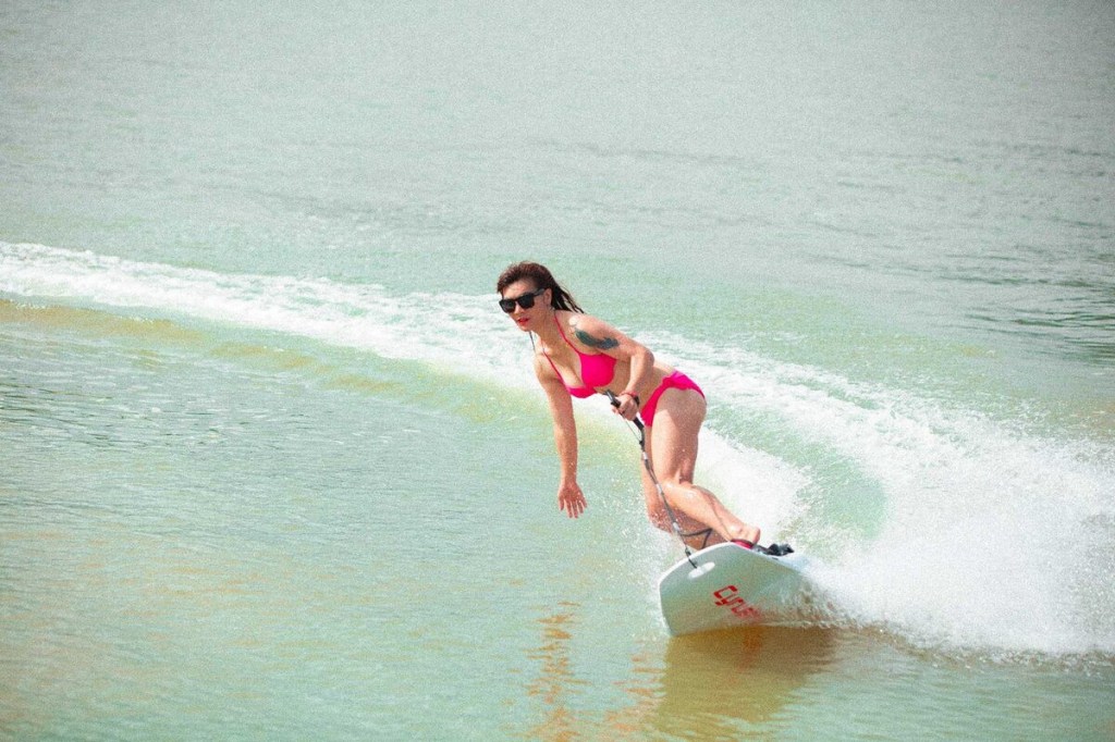 Rider surfing on Cyrusher Thunder 54-inch electric surfboard 