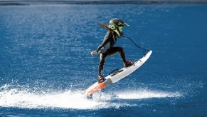Surfer riding Cyrusher Thunder 54-inch electric surfboard