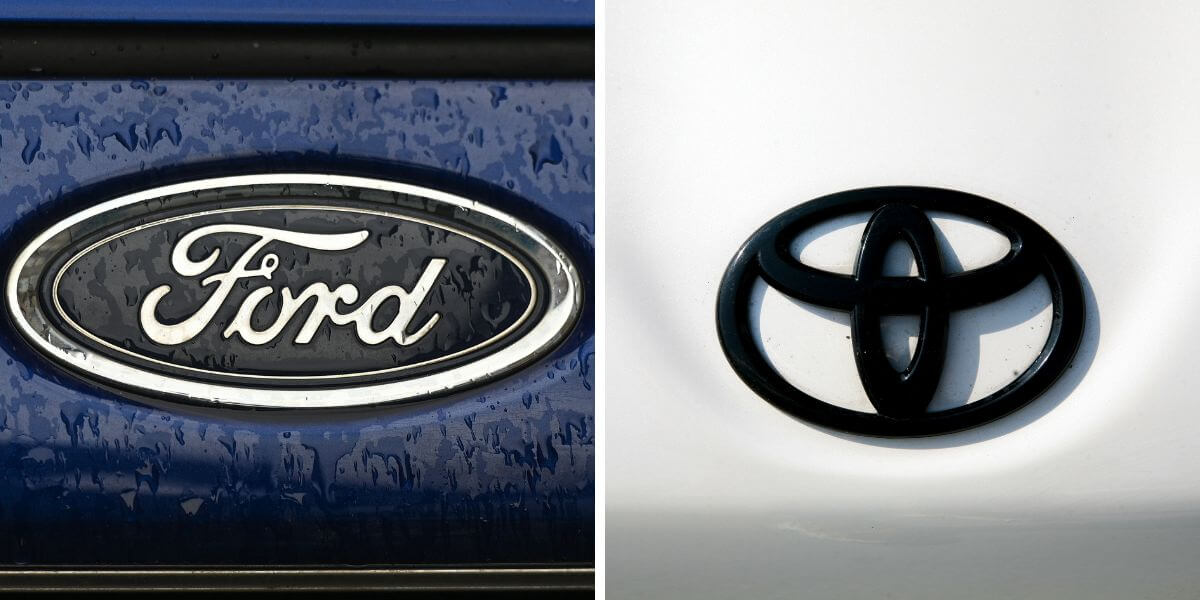 The automaker logos of the Ford (L) and Toyota (R) car companies
