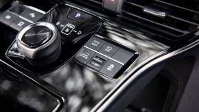 The interior of a 2023 Toyota bZ4X electric compact SUV model featuring its transmission gear selector module