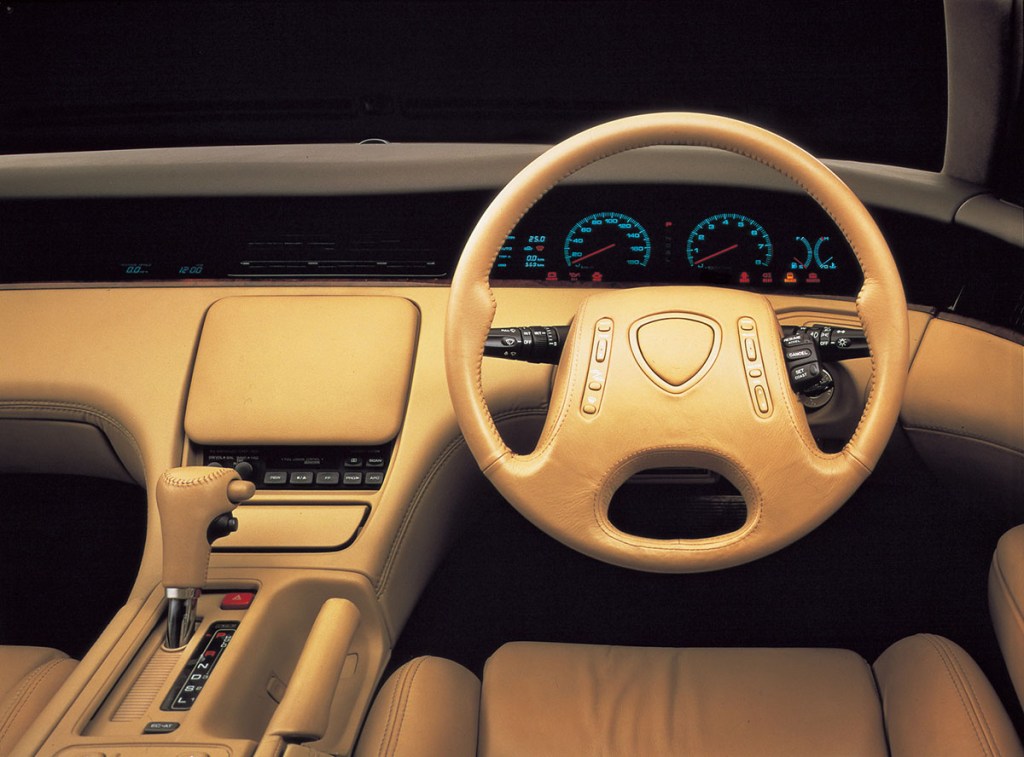 Tan leather interior of a 1990s Mazda Eunos Cosmo