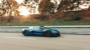 Rimac Nevera electric hypercar speeding down the street with a blurred background
