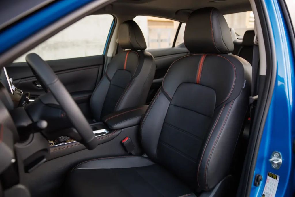 2024 Nissan Versa sedan black interior with red accents