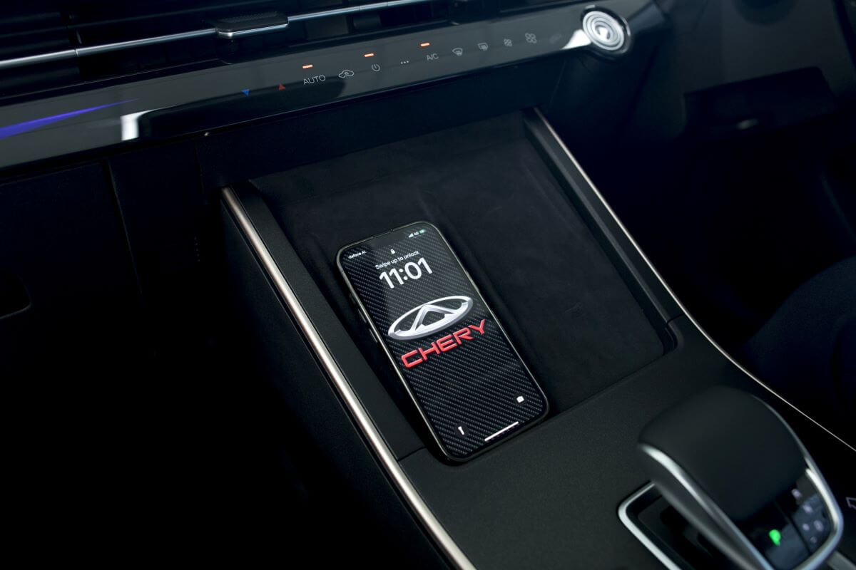 A wireless charging station featured inside a Cherry Omoda 5 model from the Chinese luxury car brand