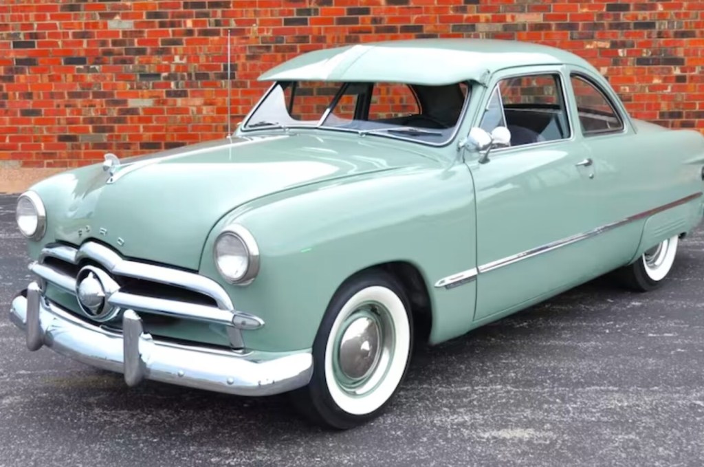 1949 Ford Deluxe in green is a cheap vintage car sold at a Mecum auction. 