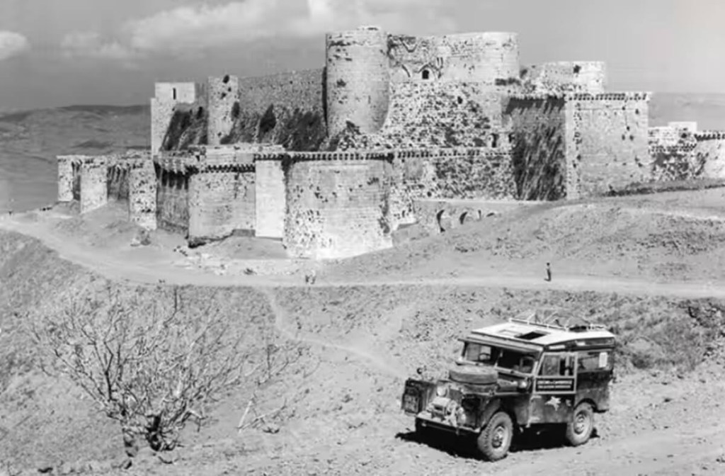 A Land Rover 4x4, a precursor to the Defender 110 model of today, drives through Albania in 1955. 