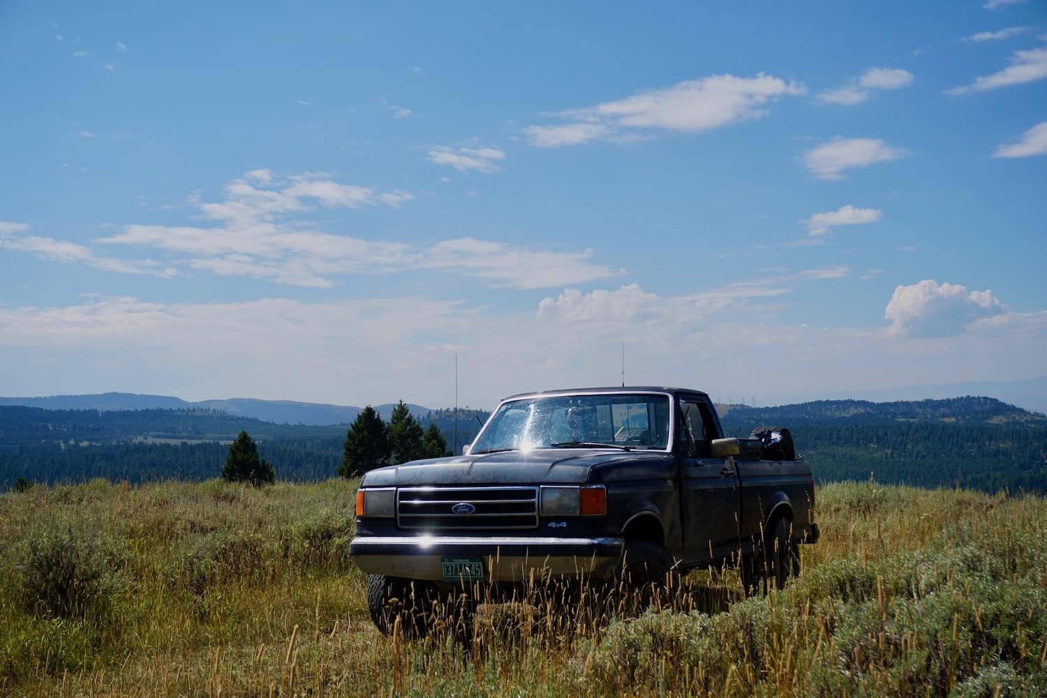 A sub-$2,000 used pickup truck parked on a mountaintop in Wyoming.