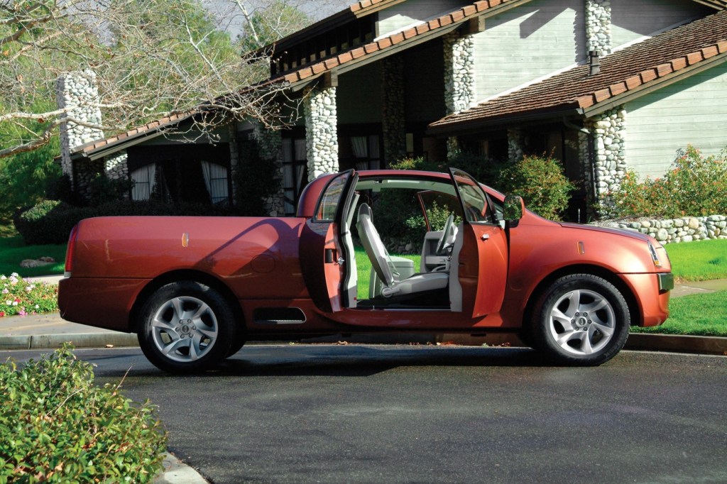 2004 Kia KCV4 EV pickup truck concept in front of house