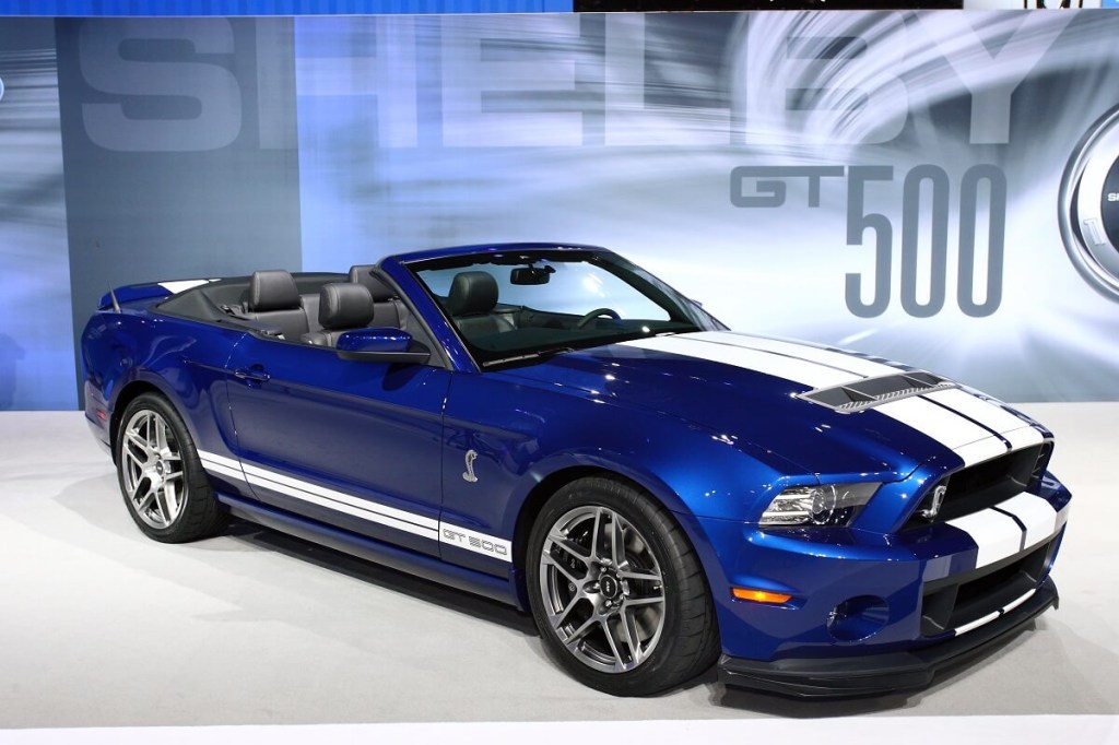 A 2013 Ford Mustang Shelby GT500, one of the cheapest muscle cars ever to hit 200 mph, shows off its convertible top.