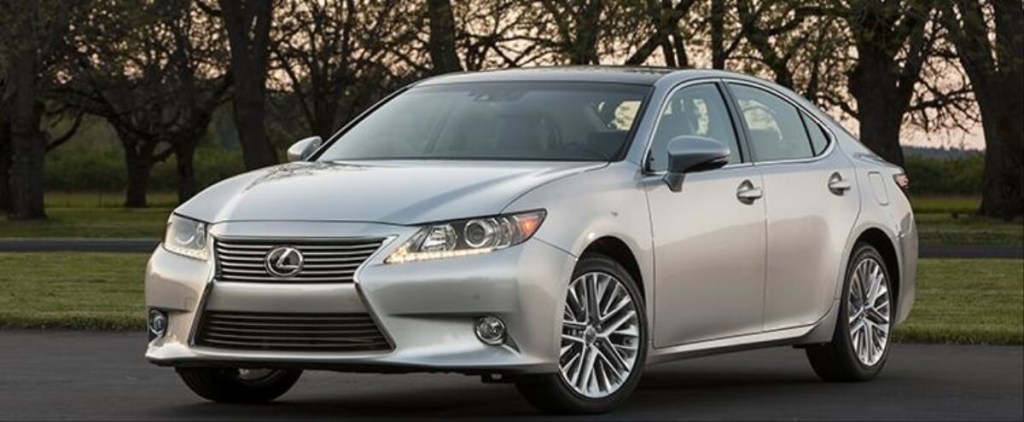 A 2015 Lexus ES 350, a cheap luxury car, sits in a park.