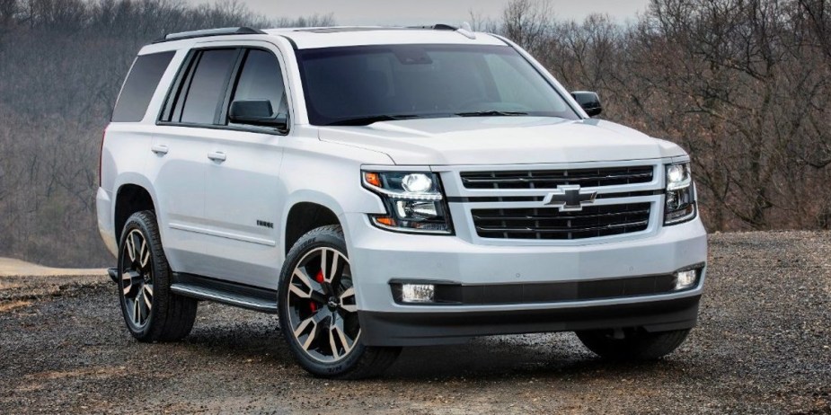 A white 2018 Chevrolet Tahoe full-size SUV is parked. 