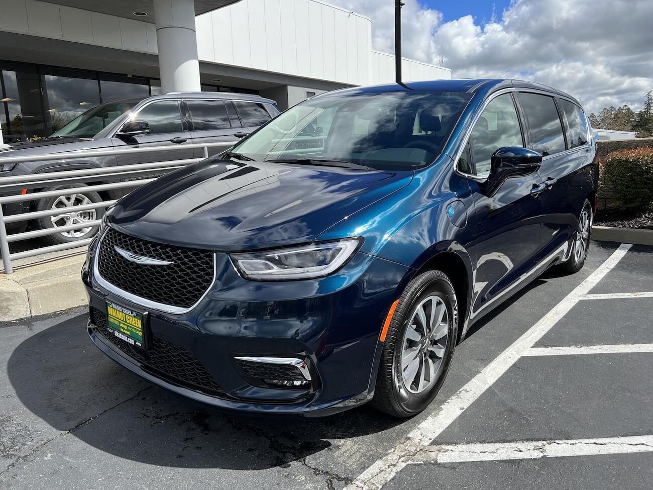 A blue 2023 Chrysler Pacifica at a Chrysler Dodge Jeep Ram dealership. Buyers should beware the Chrysler Pacifica's reliability