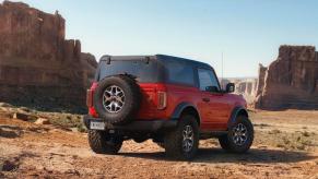 2023 Ford Bronco Badlands in Race Red in the desert. The 2023 Ford Bronco's price holds it back.