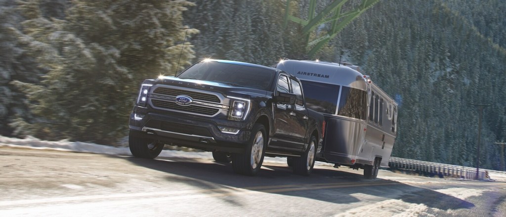 The 2023 Ford F-150 Hybrid towing a camper